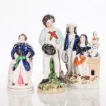 19TH CENTURY STAFFORDSHIRE FIGURE GROUP
modelled as a gentleman and woman together with a rabbit,