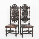 PAIR OF LATE VICTORIAN CARVED OAK HALL CHAIRS
the pierced back with scrolling motifs,