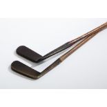 TWO ANTIQUE HICKORY SHAFTED GOLF CLUBS
one stamped "TAYLOR'S PUTTER" by Cann & Taylor,