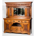 EARLY 20TH CENTURY ARTS & CRAFTS OAK MIRROR-BACKED SIDEBOARD
the mirrored back with floral carved