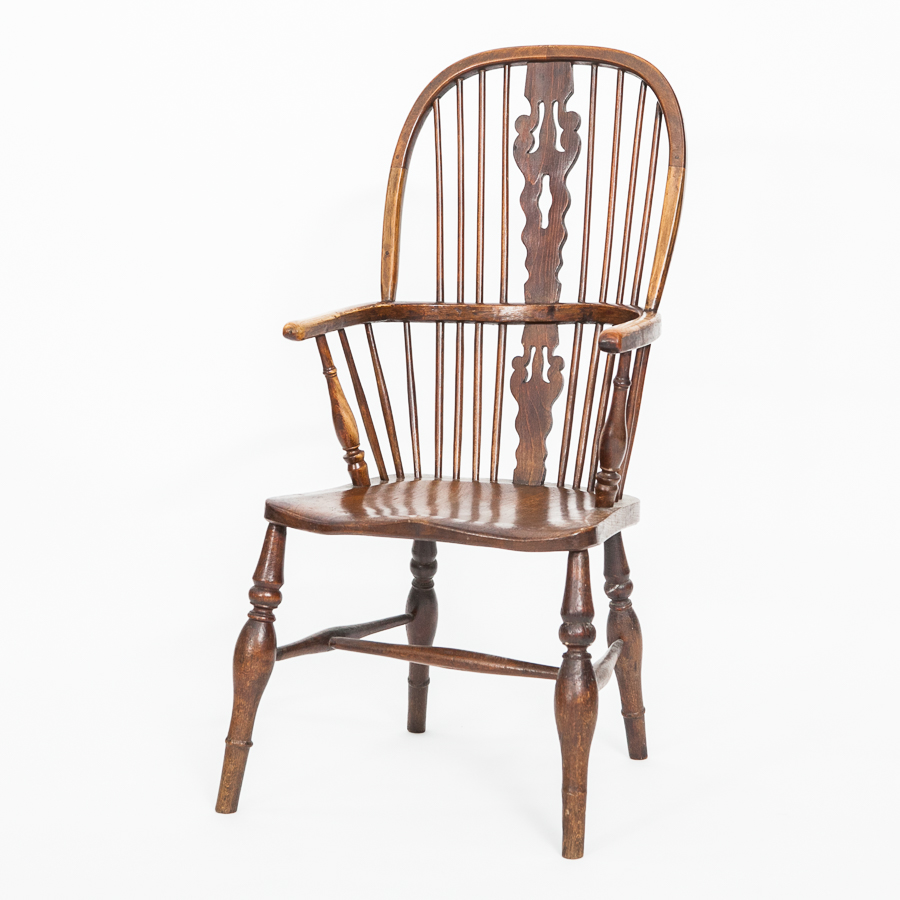 19TH CENTURY ELM WINDSOR-STYLE ARMCHAIR
with carved spine back and rails, on turned legs,