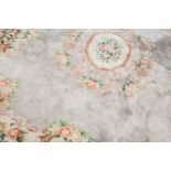 20TH CENTURY CHINESE WOOL RUG
with stylised foliage floral designs, approximately 380cm long,