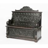 LATE 19TH CENTURY CARVED OAK HALL SETTLE
decorated with stylised foliate motifs, 95cm high, 121.