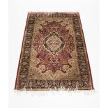 20TH CENTURY PERSIAN SILK BLEND RUG
in green and red tones,