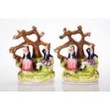 PAIR OF 19TH CENTURY STAFFORDSHIRE FIGURES 
depicting a man and a woman in traditional Scottish