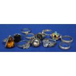 TWELVE VARIOUS SILVER AND GEM SET RINGS
including an amber ring, a multi gem ring, an intaglio ring,