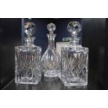 THREE CRYSTAL DECANTERS