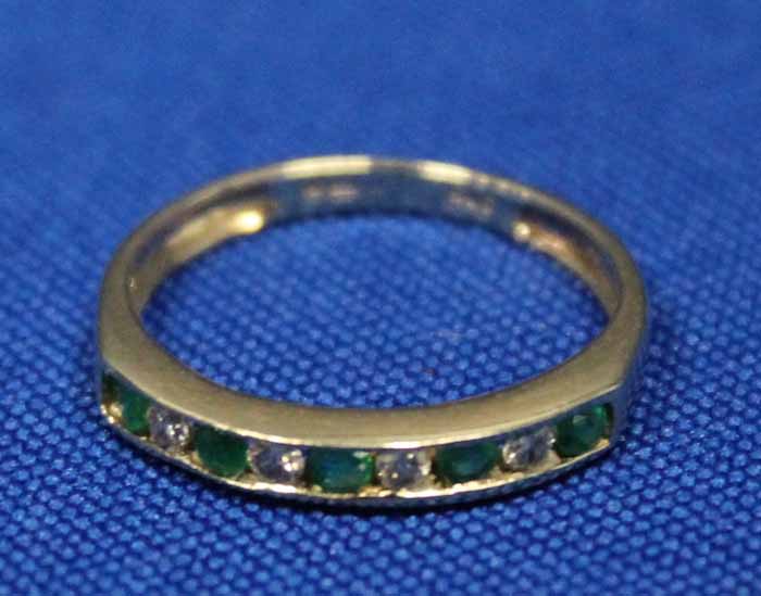 EMERALD AND DIAMOND DRESS RING
with channel set emeralds and diamonds,