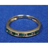 EMERALD AND DIAMOND DRESS RING
with channel set emeralds and diamonds,