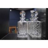 FOUR EDINBURGH CRYSTAL DECANTERS
all of square form, one etched with thistle design,