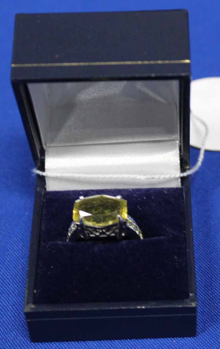 NINE CARAT WHITE GOLD CITRINE RING
with a large fancy cut citrine,