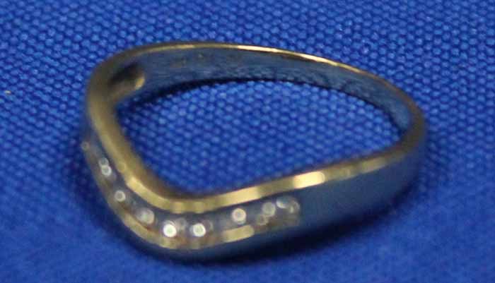 DIAMOND HALF ETERNITY RING
of wishbone form, channel set with brilliant cut diamonds,