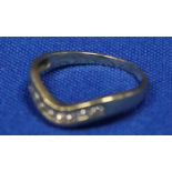 DIAMOND HALF ETERNITY RING
of wishbone form, channel set with brilliant cut diamonds,