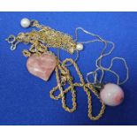TWO PEARL PENDANTS
set with spherical pearls,