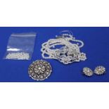 SILVER PASTE SET BROOCH
of overall circular form, openwork and set with round white pastes,