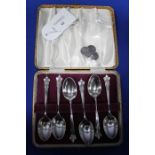 SET OF SIX SILVER TEASPOONS IN A FITTED CASE
along with a pair of cufflinks,