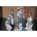 COLLECTION OF FIVE LLADRO FIGURES AND A NAO FIGURE