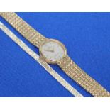 LADY'S OMEGA NINE CARAT GOLD BRACELET WATCH
along with a bracelet stamped '585'