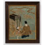 JAPANESE EMBROIDERY ON SILK 
depicting two figures in procession, with profuse gold thread weave,