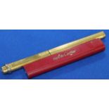 CARTIER GOLD PLATED BALL POINT PEN
with engine turned body and stamped with serial number;