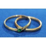 TWO NINE CARAT GOLD RINGS
comprising of one wedding band and one emerald ring (2)