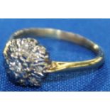 DIAMOND CLUSTER RING
with a graduated, stepped cluster of brilliant cut diamonds,