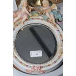 TWO CONTINENTAL CERAMIC FRAMED TABLE MIRRORS 
together with two ceramic figures and two glass