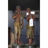 PAIR OF SPELTER FIGURINES
modelled as male and female rural workers,