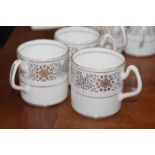 EIGHT COALPORT SPANISH LACE PATTERN COFFEE CANS AND EIGHT SAUCERS 
together with a modern onyx