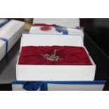 COLLECTION OF THREE SWAROVSKI CRYSTAL FLOWERS
in original boxes