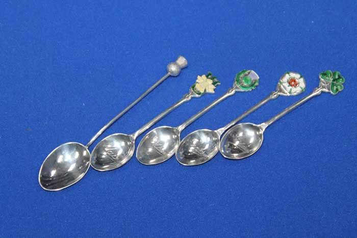 FOUR SILVER AND ENAMEL COFFEE SPOONS
each terminal enamelled with the emblems of each of the