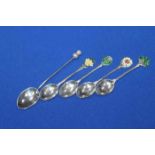 FOUR SILVER AND ENAMEL COFFEE SPOONS
each terminal enamelled with the emblems of each of the