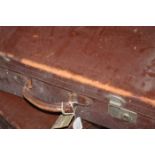 THREE VINTAGE LEATHER SUITCASES