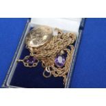 9CT GOLD LOCKET AND TWO AMETHYST PENDANTS
the pendants also in gold,