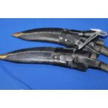 TWO KUKHRI
each in a leather sheath