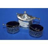 EDWARDIAN SILVER SALT DISHES
with pierced decoration and blue glass liners,