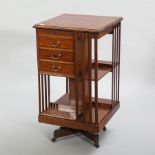 EDWARDIAN INLAID MAHOGANY REVOLVING BOOKCASE
of square form, with three small drawers,