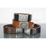FOUR THIRD REICH BELT BUCKLES AND LEATHER BELTS
comprising an aluminium Lufftwaffe buckle depicting