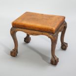 EARLY 20TH CENTURY WALNUT STOOL
with a studded leather seat,