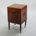 MAHOGANY INLAID NINE DIVISION CELLARETTE
with ivory escutcheons, on tuend legs and castors,