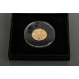 THE CROWN JEWELS GOLD PROOF COIN EMBEDDED WTH FOUR PRECIOUS STONES
dated 2006, set with a sapphire,