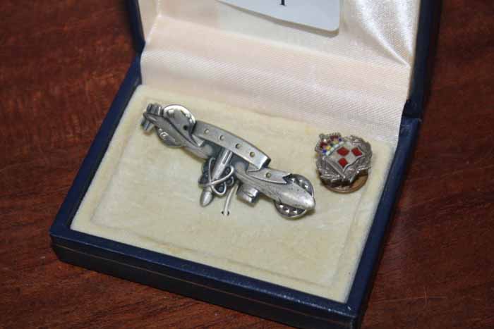 STERLING SILVER MILITARY PIN
modelled in the shape of a u-boat;