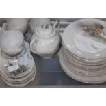 EGGSHELL PART TEA SET
including cups and saucers, side plates, a teapot,