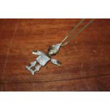 GOLD AND DIAMOND SET PUPPET PENDANT
with sapphire set eyes,