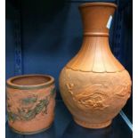 20TH CENTURY CHINESE TERRACOTTA VASE
of baluster form, with incised Greek key and foliate motifs,