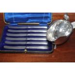 SILVER SAUCE BOAT
London hallmarks; together with a set of six silver handled butter knives,