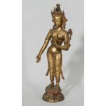 LARGE EASTERN BRASS FIGURE OF A DEITY
the figure modelled standing and with one hand raised,