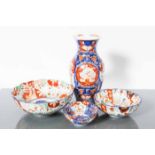 JAPANESE IMARI VASE AND THREE IMARI BOWLS 
the vase of baluster form,