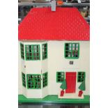 EARLY 20TH CENTURY TIN FRONTED 'TRI-ANG' DOLLS HOUSE
cream body, gren windows and red roof,