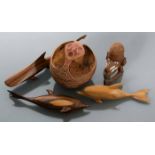 COLLECTION OF PAPUA NEW GUINEA WOOD CARVINGS
comprising a mask, carved coconut, and three dolphins,